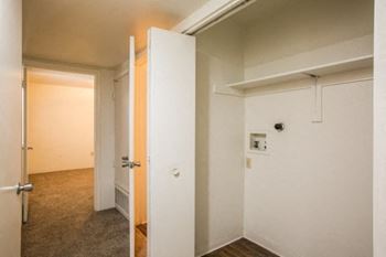 a room with a door open and a hallway to another room